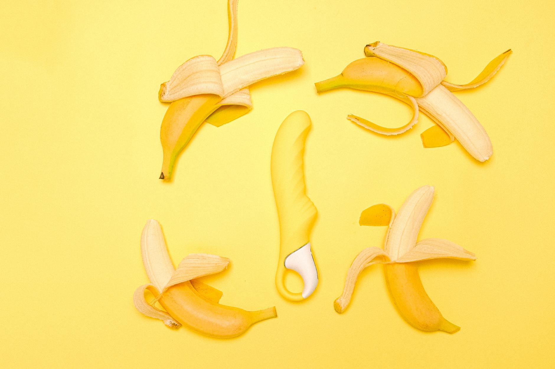 Lemon vibrator on bright yellow background symbolizing perimenopause wellness